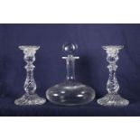 Baccarat ships decanter and two twist style baluster shaped candlesticks, 23cm.