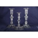 Pair of 18th Century candlesticks, one with drack both on Silesean stems and domed foot, 21cm and