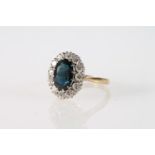 18ct gold cluster ring with twelve diamonds encircling blue/green oval cut stone, size P, 4.9g