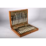 George V set of twelve fruit knives and forks with silver and mother of pearl handles, hallmarked