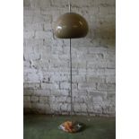 Mid-20th century chromed metal floor lamp with beige circular plastic shade in the manner of