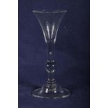 18th Century light baluster wine glass with single knop. folded foot chipped, 18cm.