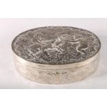 A late 19th century Dutch silver oval box, the chased cover decorated with three cherubs and goat,