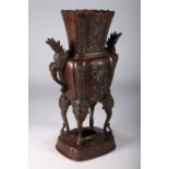 Japanese bronze vase Meiji 1868-1912 with mythical grotesque twin handles, allover raised floral