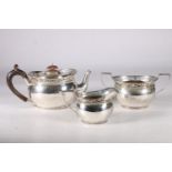 Edward VII silver bachelor tea service with foliate pierced rims and lion rampant to sides,