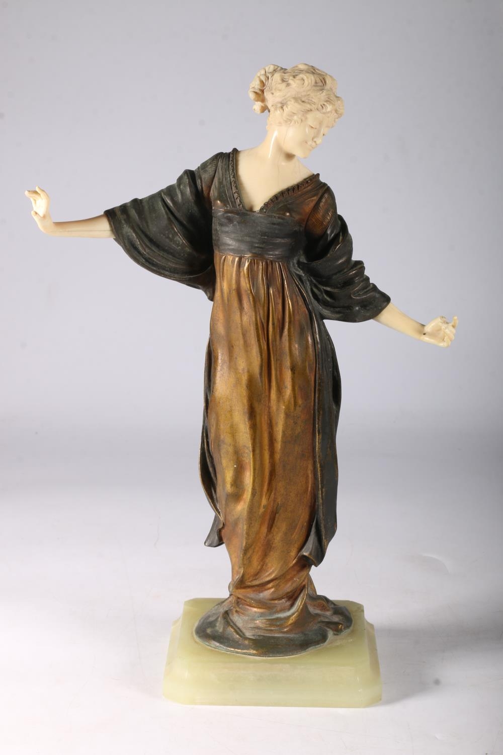 1920/30's sculpture of dancing woman in flowing bronze dress stamped France and 70V, on green onyx