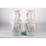 Pair of Chinese famille rose baluster shaped vases with panels depicting courtly scenes and battles,