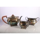 George V Scottish silver tea set to include tea pot, 14cm, sugar bowl and milk jug, hallmarked