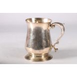 George II silver baluster mug, with a capped scrolled handle, on socle base, hallmarked London 1757,