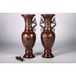 Pair of oriental brass twin handled vases with dragon handles, decorated with birds and flowers,