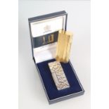 Dunhill rollagas lighter with textured exterior, marked Made in Switzerland, with original box,