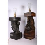 Two table lamps with stems formed of unworked wood and topped with block tops on  block bases,