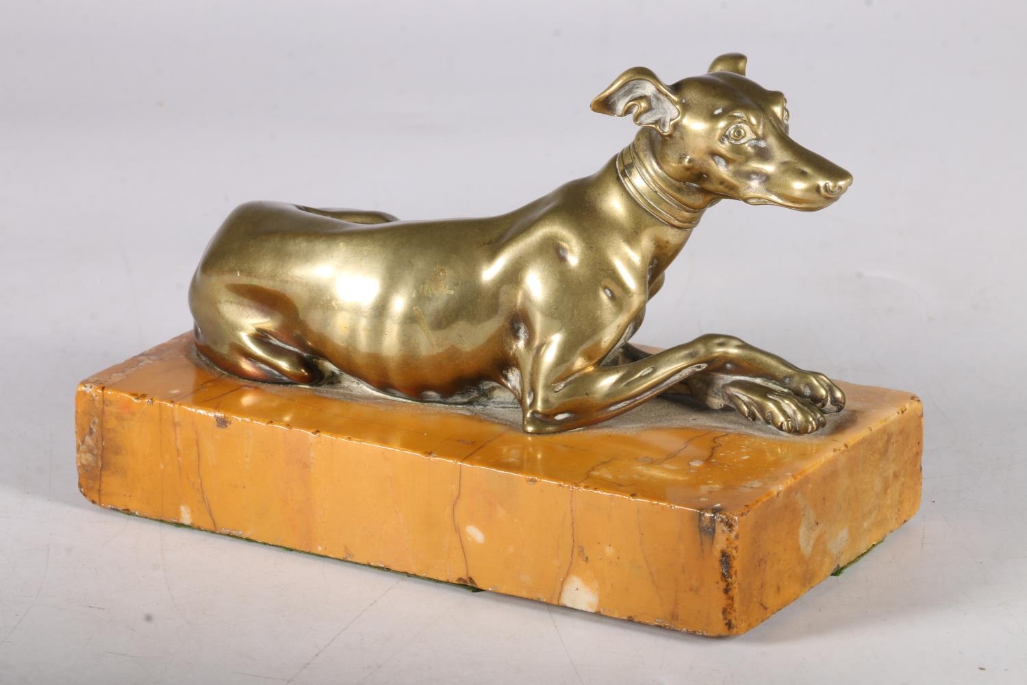 Bronze seated greyhound on marble plinth base in the manner of Thomas Weeks of London, 16cm long.