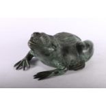 Cast metal sculpture of frog with verdigris finish, 9 x 20 x 15cm.