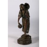 A bronze water carrier, signed Besserdich (1858-1915) In the form of a female figure carrying