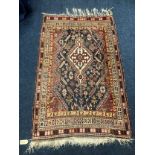 North west Persian rug with stylized flowerheads to field and multiple borders, 167 x 113.