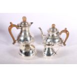 George V bachelor tea set, hallmarked William Comyns & Sons Ltd, London 1929, and a coffee pot