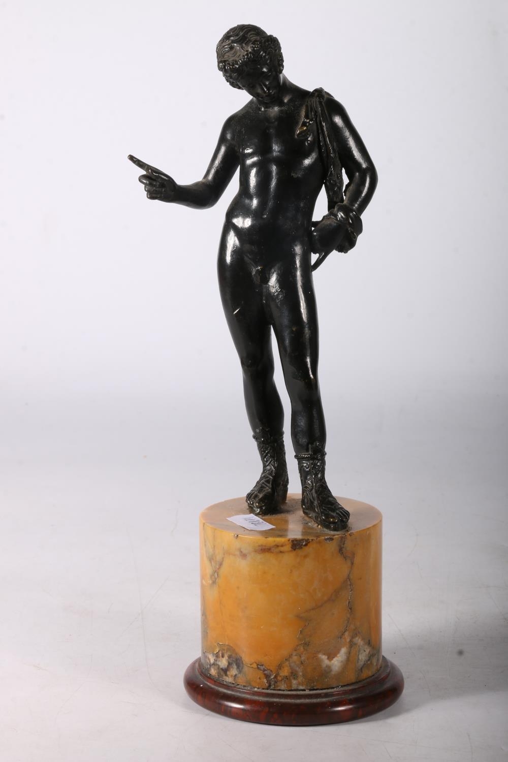Bronze figure of Narcissus on yellow marble plinth base, 28cm tall.