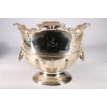 An Edwardian silver rose bowl, having a Monteith style shaped edge with moulded decoration, on socle