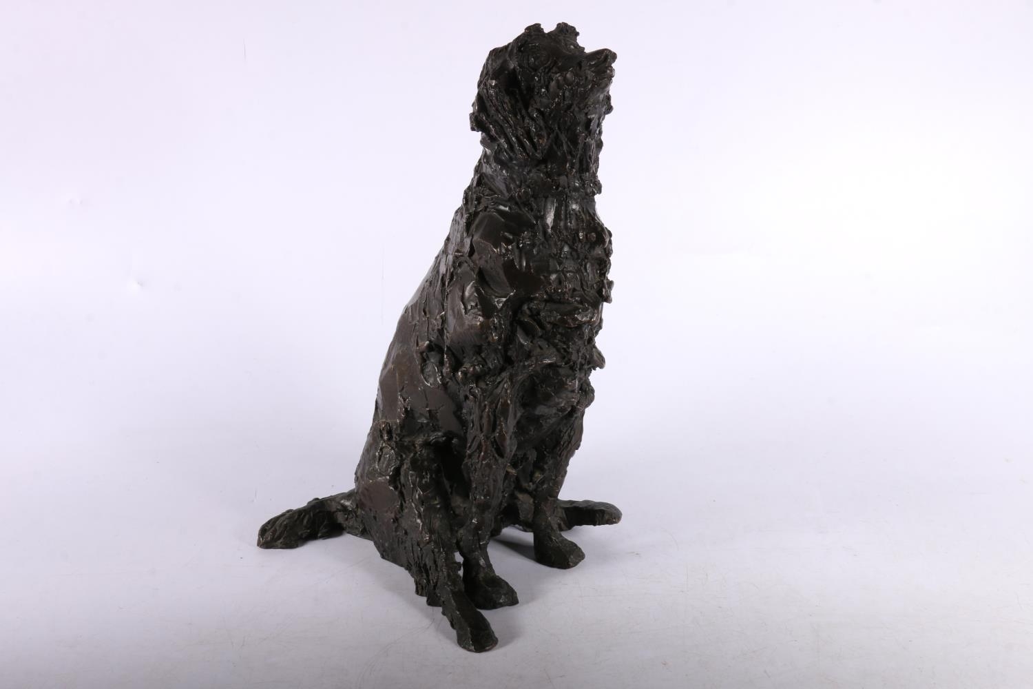 Heavy bronze sculpture of seated lurcher, signed with monogram B, 29cm tall.