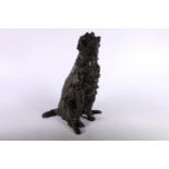Heavy bronze sculpture of seated lurcher, signed with monogram B, 29cm tall.