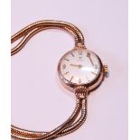 Tissot lady's 9ct gold bracelet watch, 13.5g without movement.