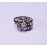 Early 20th century diamond cluster ring with old-cut brilliant, approximately .5ct, surrounded by