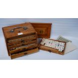 Chinese mahjong set (20th century) contained in a wooden export case with handle and five drawers