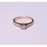 Diamond solitaire ring with small brilliant in 18ct gold, 1983, size I, 2.3g gross.