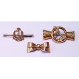 Gold bow brooch, ‘9ct’, another, formerly a bracelet mount with fouled anchor, and another, similar,