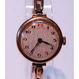 Vintage lady's manual wind 9ct gold wristwatch, the dial with Arabic numerals, on 9ct gold expanding