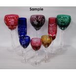 Composite suite of German harlequin-coloured cut crystal glassware comprising twelve hock glasses,
