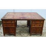 Carved oak partner's desk, c. early 20th century, with tooled skiver above drawers and doors to both