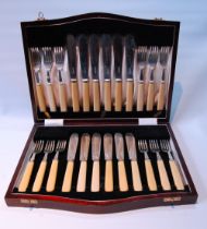 Set of twelve silver fish knives and twelve forks (Xylonite handles) by Cooper Brothers & Sons,