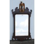 Regency-style mahogany scroll wall mirror with gilt eagle surmount to the top, 101.5cm high and 53cm
