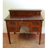 Late Victorian inlaid mahogany desk, the superstructure with long drawer above deep drawers