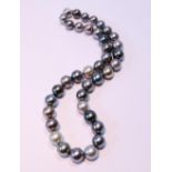 Black and tinted pearl necklet on diamond-set gold ball snap, '750', by JKa Koehle.