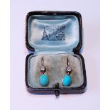 Pair of drop earrings, each with an oval turquoise and diamond brilliant, c. 1900.