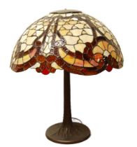 Good quality Tiffany of New York-style table lamp with large multi-coloured stained leaded shade, on