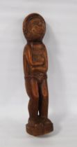 Tribal wooden figure, possibly of Polynesian origin, the arms in folded position, incised painted