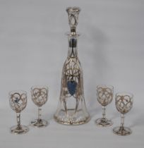 Silver overlaid glass liqueur set comprising a decanter and stopper, and four matching glasses,