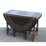 Antique oak gateleg supper table in the Charles II style, with all over banding of motifs to the top