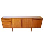 Mid-century teak sideboard by McIntosh & Co., Kirkcaldy with two central cupboard doors enclosing