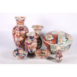 Chinese Imari porcelain to include a lidded pot and cover, 25cm diameter, five vases, the largest