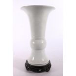 Chinese white glazed flared vase of slender zun form 23cm high. #59
