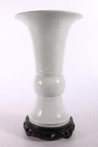 Chinese white glazed flared vase of slender zun form 23cm high. #59