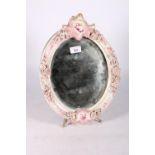 A 19th century porcelain oval table mirror with relief floral decoration, Meissen blue crossed