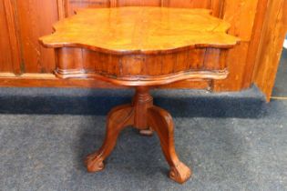 A late 17th century or early 18th centruy walnut occasional table, serpentine front with two