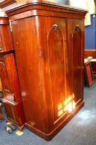 A Victorian mahogany two door wardrobe, with two interior base drawers, raised on plinth base, 207cm