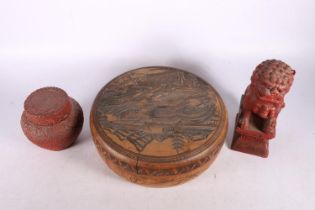 Chinese cinnabar ginger jar and cover, 10cm high, a cinnabar lacquered lion dog, 18cm high, and a
